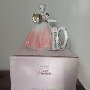 Charming Figurine with Gold Accents